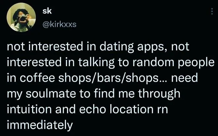 Tweet about introverts avoiding dating apps and random social interactions, seeking soulmate through intuition, reflecting introvert nation humor.