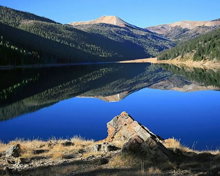 A Private Camp Lake In Wyoming. Down The Hill There Were Giant Red And Yellow Demoiselles Rock Pillars.