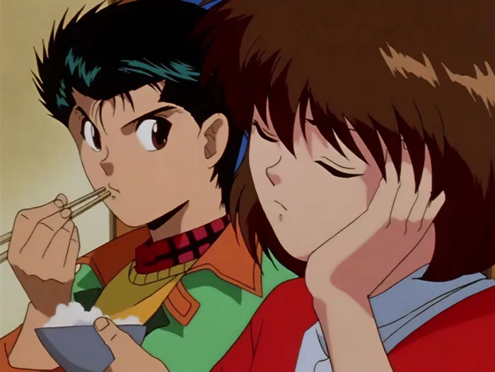 Anime couple sharing a meal, showcasing one of the cutest anime pairs beloved by fans.