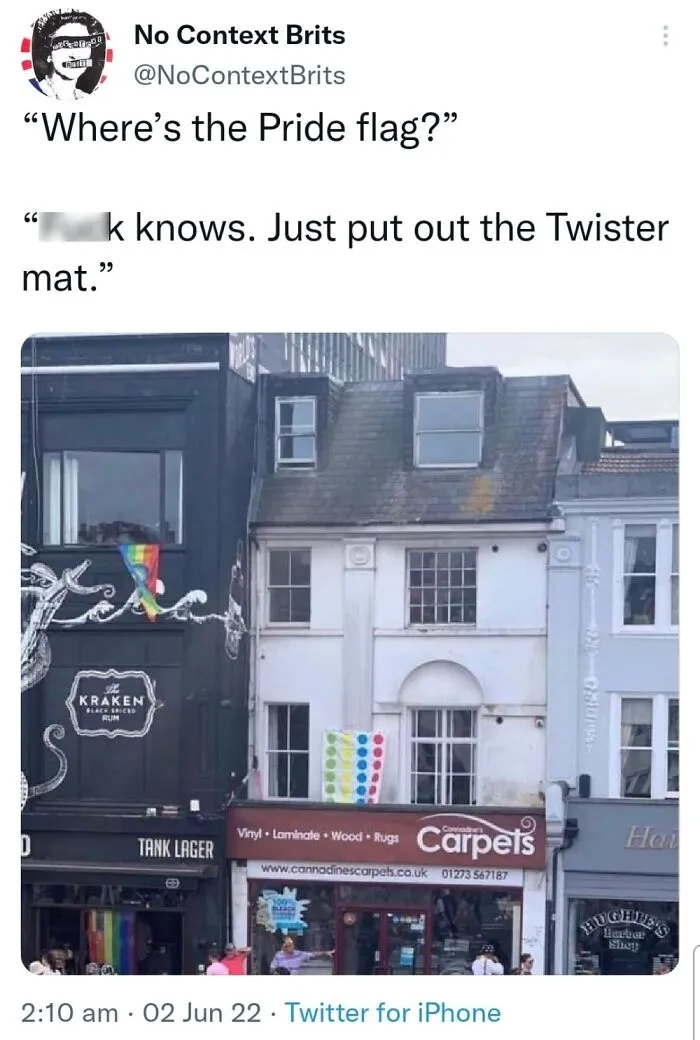 LGBTQ+ meme with a pride flag joke featuring a Twister mat on a building facade.