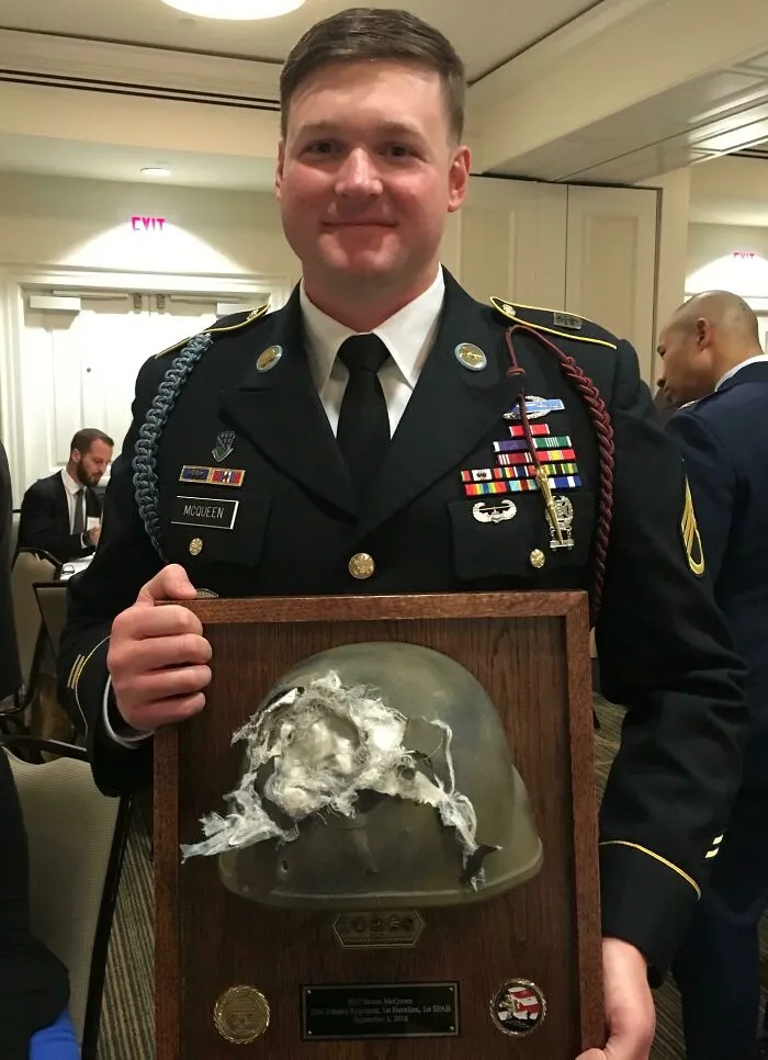 The Soldier Receives His Mounted Helmet That Took A 7.62 Round At 20 Feet While Wearing It
