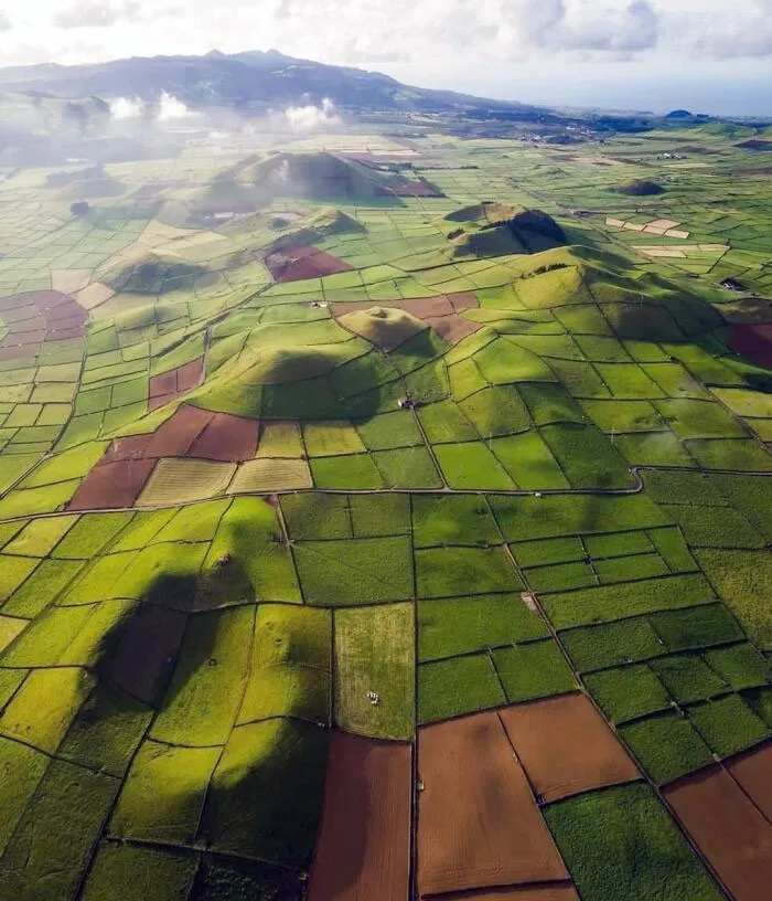 This Landscape Looks Like Someone Just Dropped A Green Quilted Blanket On The Earth
