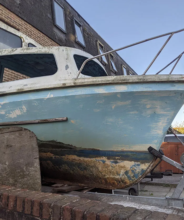 The Wear And Scuff Marks On This Boat Look Like An Island In The Sea