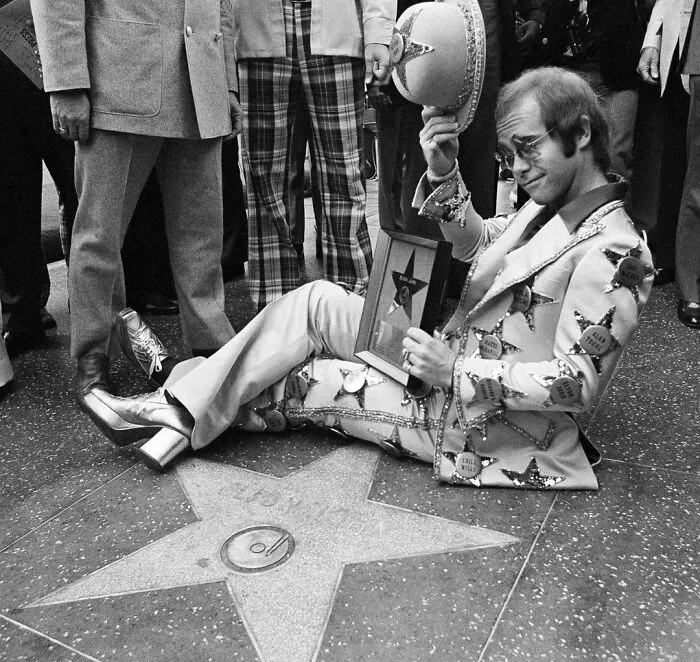 Elton John Posing After Having A Star Dedicated To Him On The Hollywood Walk Of Fame, 1975 (By Jeff Robbins)
