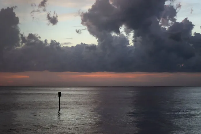 Still Water Under A Pink-Streaked Sky
