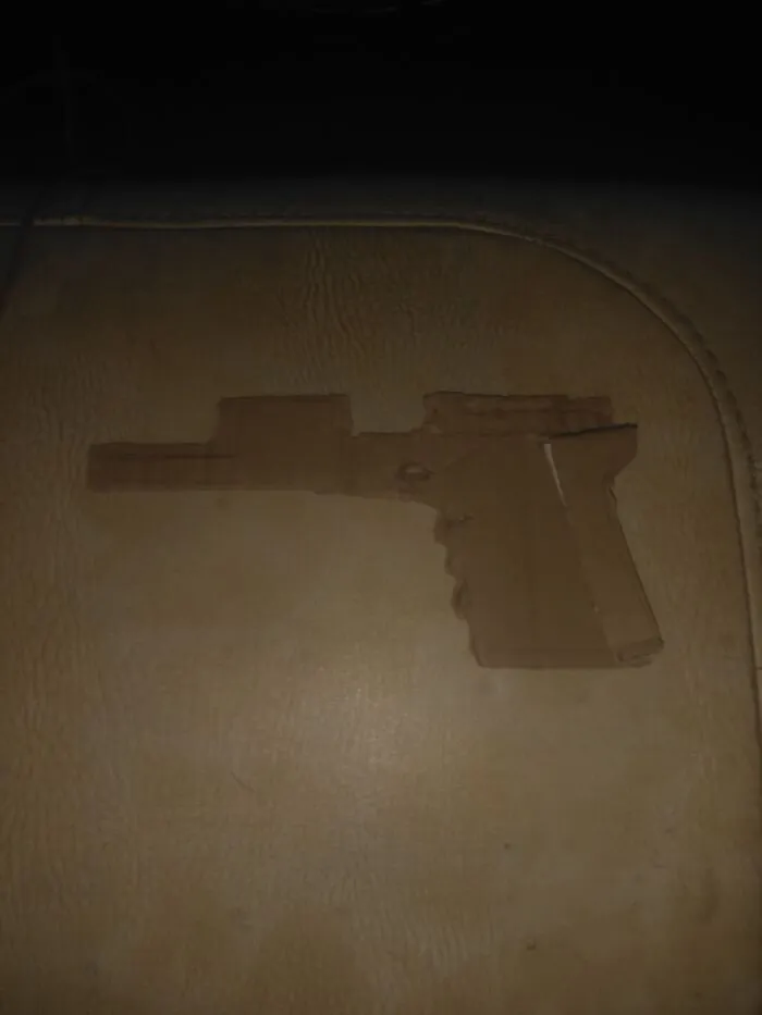 A Pistol. Colt M1911 To Be Specific