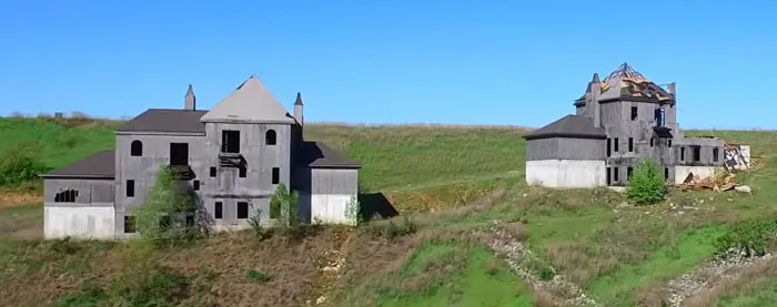 These Homes Are A Huge A Shame... Can You Imagine If You Bought One Of These, Thinking It Was Going To Be A Fabulous Area! They Do Look Haunted. Apparently This Was A Billion Dollar Project Near Branson, Mo, That Ended Up Being Abandoned