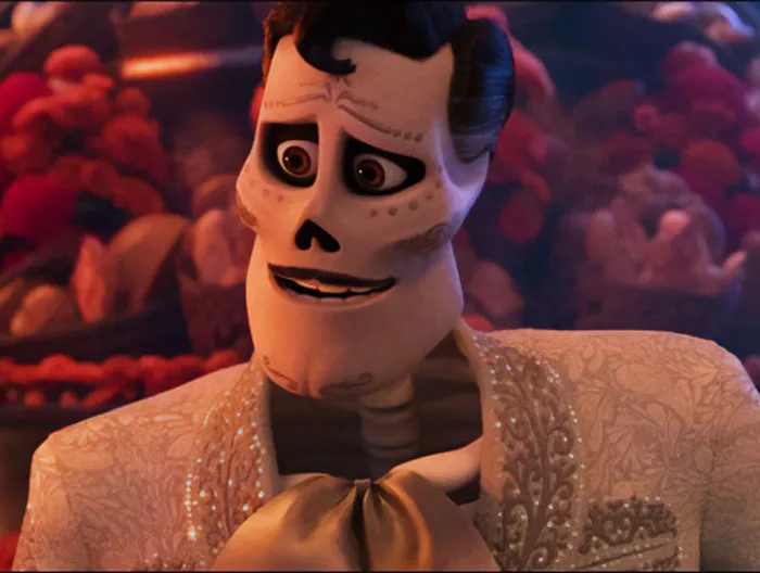 Ernesto De La Cruz wearing a white suit 
