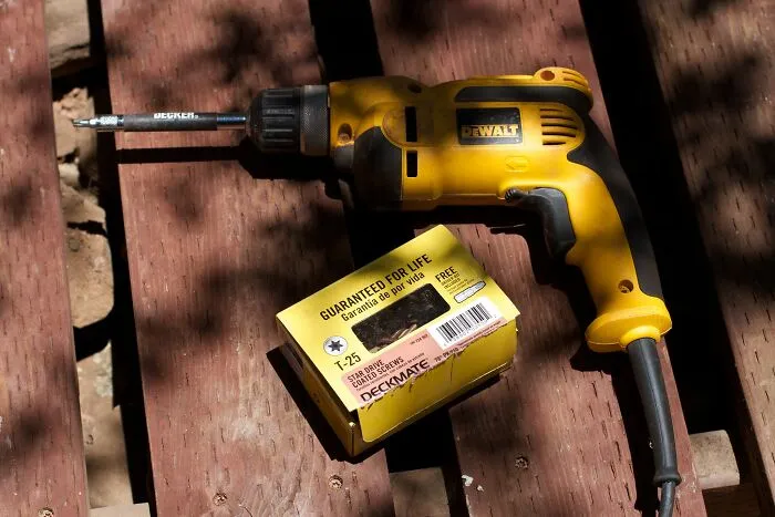 Drilling Into The Side Of One's Thigh With A 10mm Drill Bit While Drilling Holes In A Flower Pot