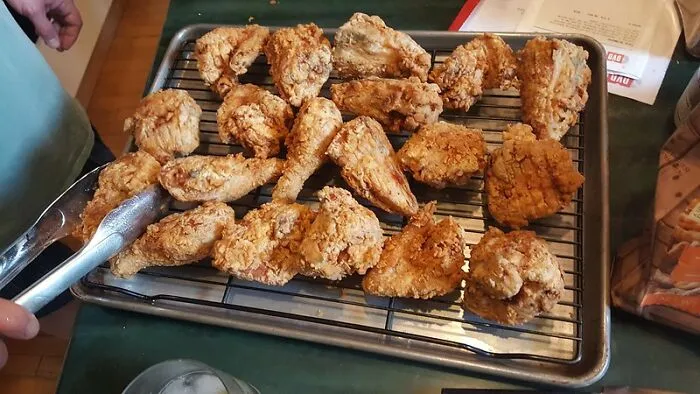 Making "Fried Chicken" By Tossing Chicken In Plain Flour And Baking Them