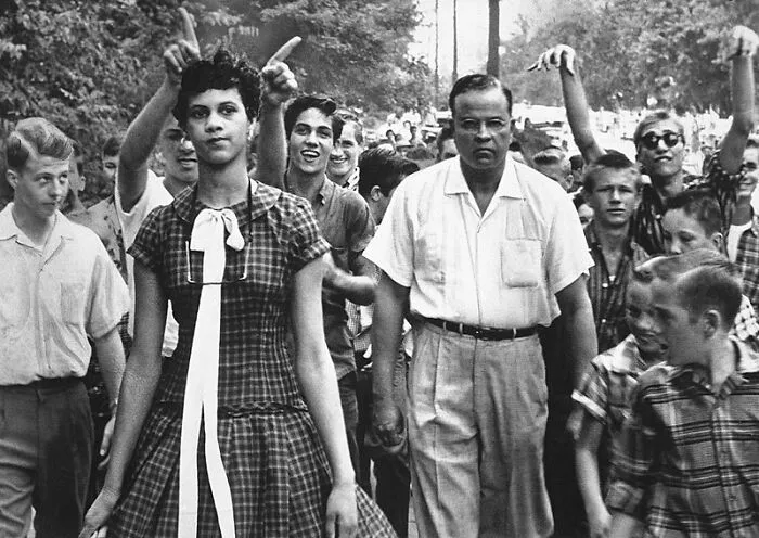 Dorothy Counts, The First Black Student To Attend An All-White School In The United States. Shown In This Photo Teased And Mocked By Her White Male Classmates