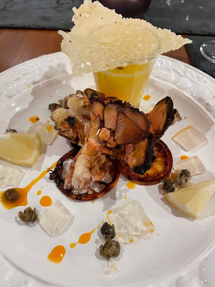 Grilled Lobster, Champagne & Saffron Beurre Blanc, Ginger & Lemongrass Jelly, Caramelised Lemon Slices, Caper Popcorn And A Parmesan Tuile With Chilli Oil