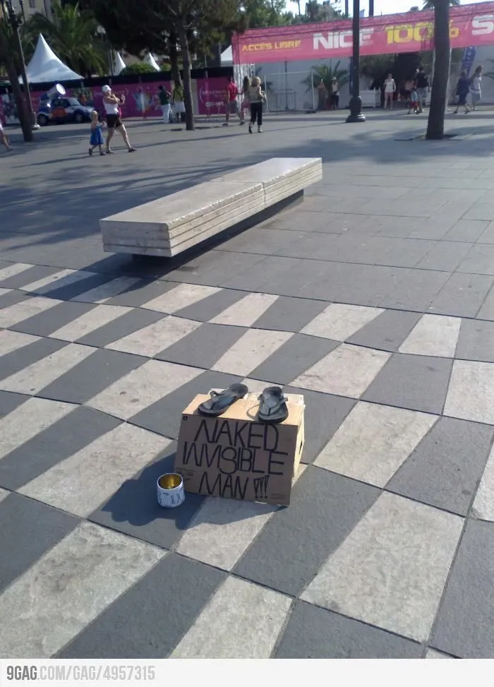 Funny sign with sandals on a box labeled "Naked Invisible Man" in a public plaza.