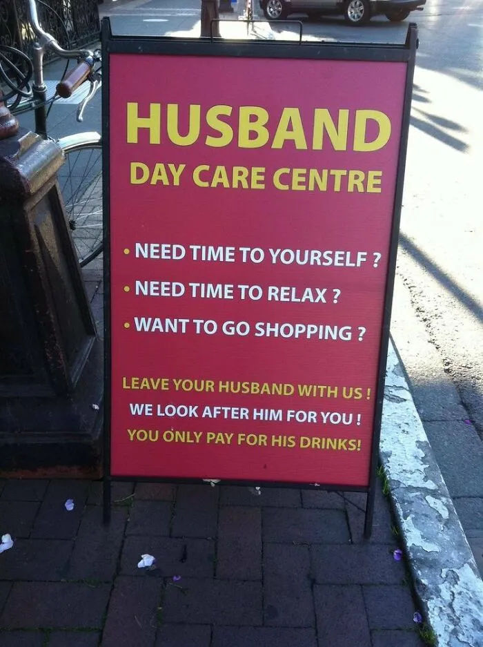 Funny sign reads "Husband Day Care Centre" offering relaxation time while watching husbands.