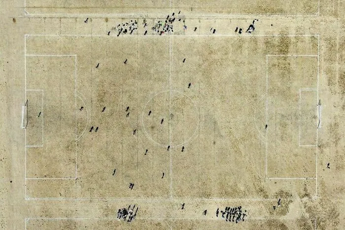 People Play A Sunday League Amateur Football Match On A Parched Grass Pitch During A Heatwave, At Hackney Marshes, In London, Britain, August 14, 2022