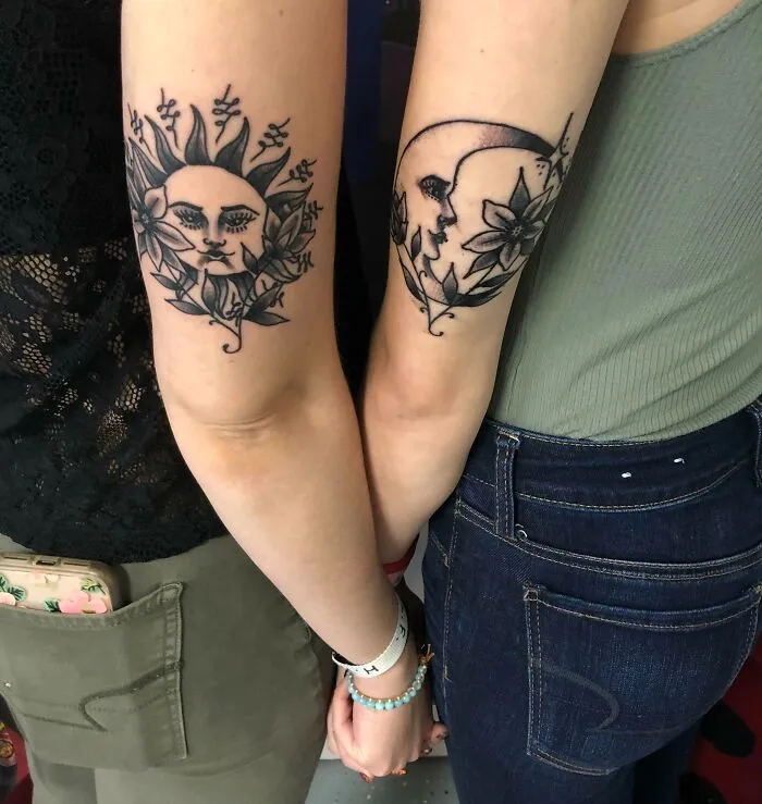 Two best friends with matching sun and moon tattoos commemorating their friendship.