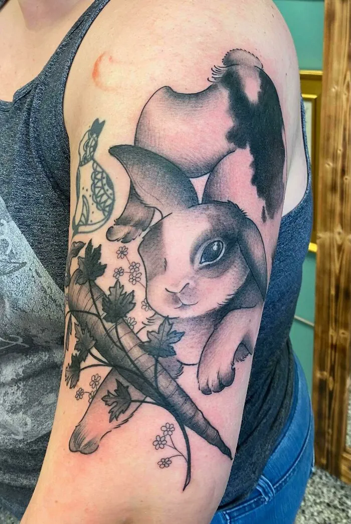 Pet tattoo of a rabbit and carrot on arm, showcasing the bond between humans and pets.