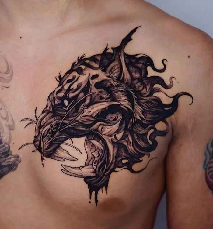 Detailed animal tattoo on chest, showcasing simplicity and realism.