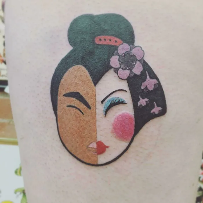 Cartoon tattoo featuring a stylized face with a floral hair accessory inspired by animated shows.