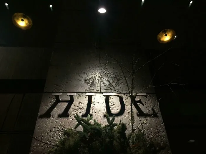 This Restaurant Sign That Is Half Shadows