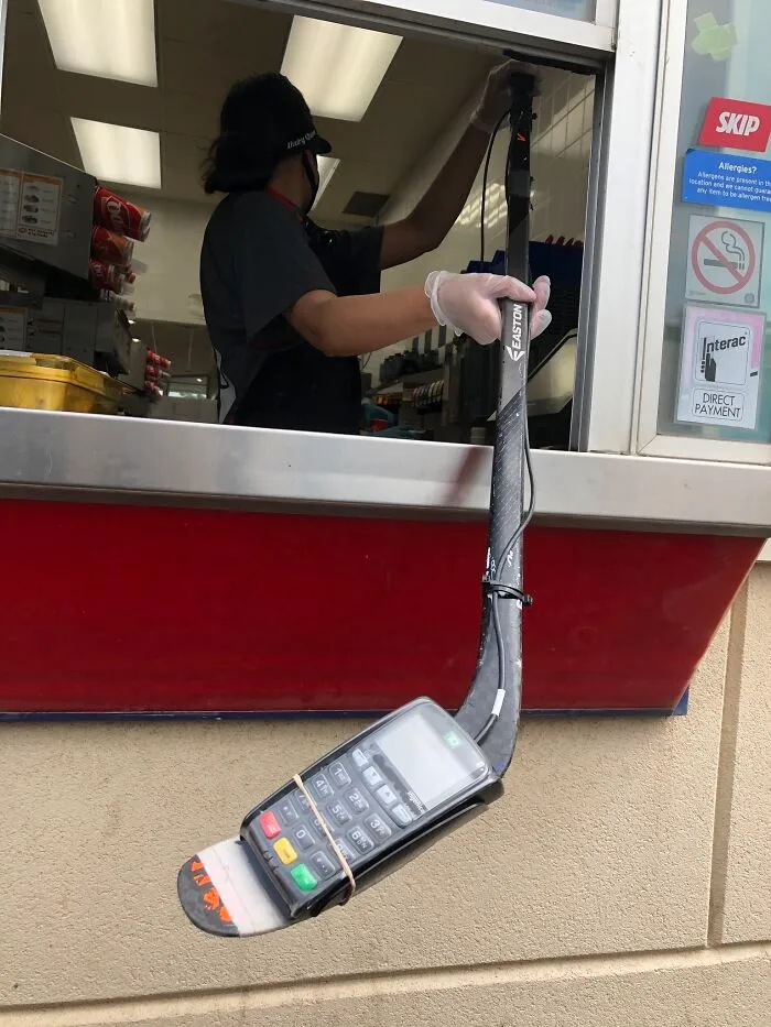This Is A Dairy Queen Drive-Through In Canada Where They Social Distance By Using A Debit Machine Zip Tied To A Hockey Stick. You Can’t Make This Up