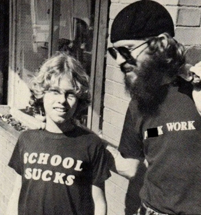 Father and son with funny messages on a t-shirt 