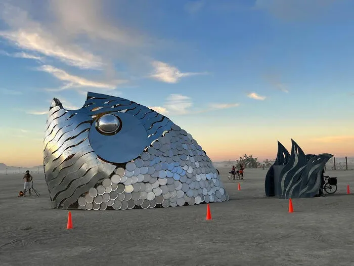 Fish head installation coming out from the ground 