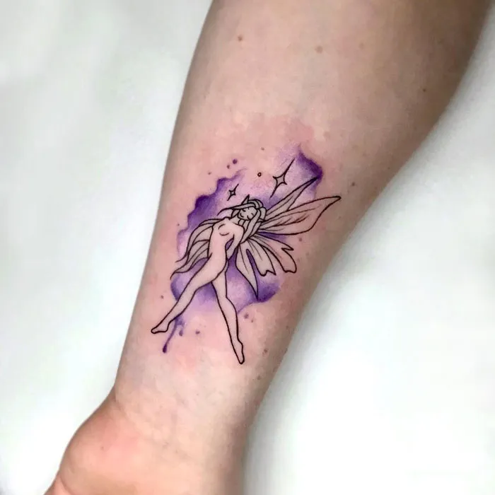 Watercolor tattoo of a fairy with purple wings on an arm.
