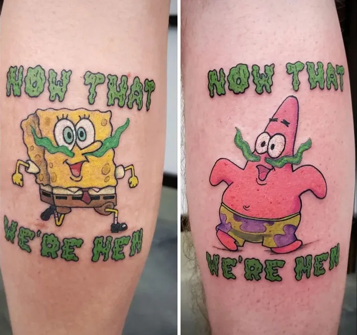 Cartoon best friend tattoos with "Now That We're Men" text on legs.