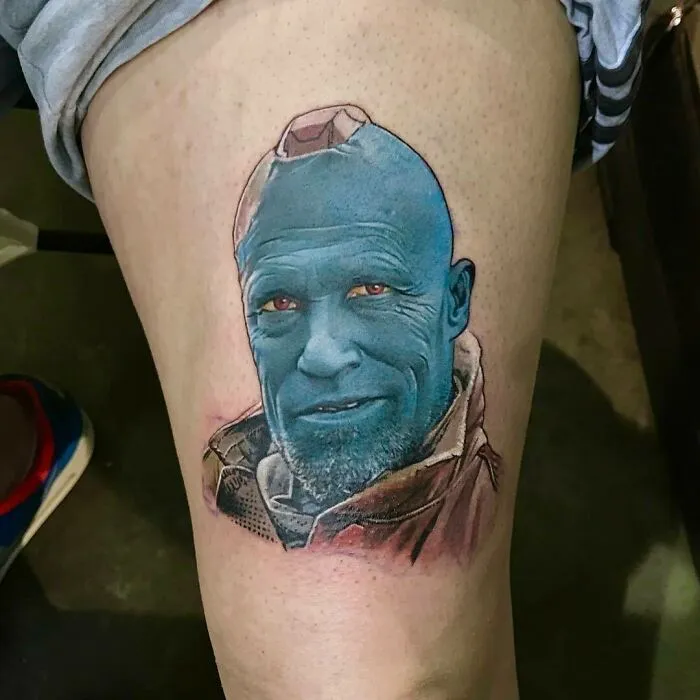 Marvel tattoo of a blue-skinned character Yondu on a person's leg.