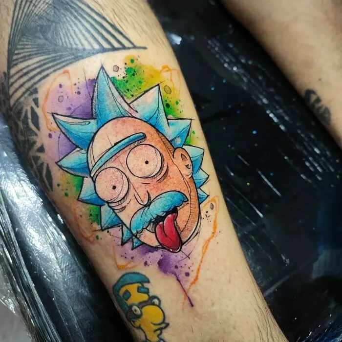 Cartoon tattoo of Rick styled as Einstein, featuring vibrant colors on arm.