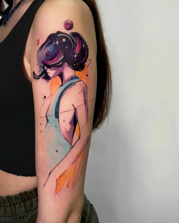Watercolor tattoo of an abstract woman on an arm, featuring bold colors and stylish design.