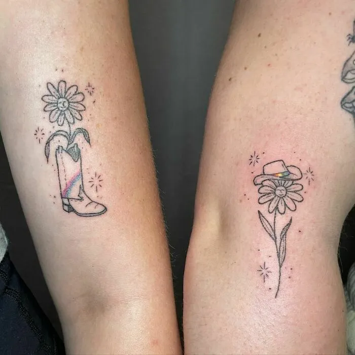 Matching best friend tattoos featuring a boot with a flower and a flower with a hat, symbolizing friendship.