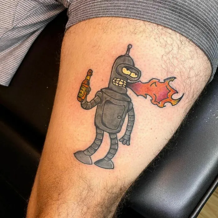 Cartoon tattoo of a robot character breathing fire, inspired by a favorite animated show, on a person's arm.