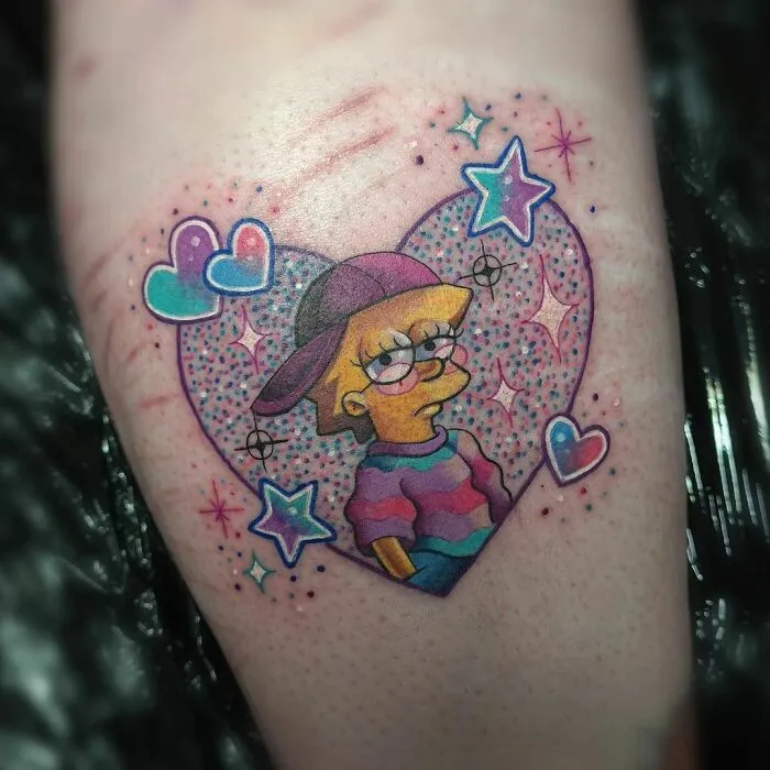 Cartoon tattoo of a character in a heart with colorful stars and sparkles.
