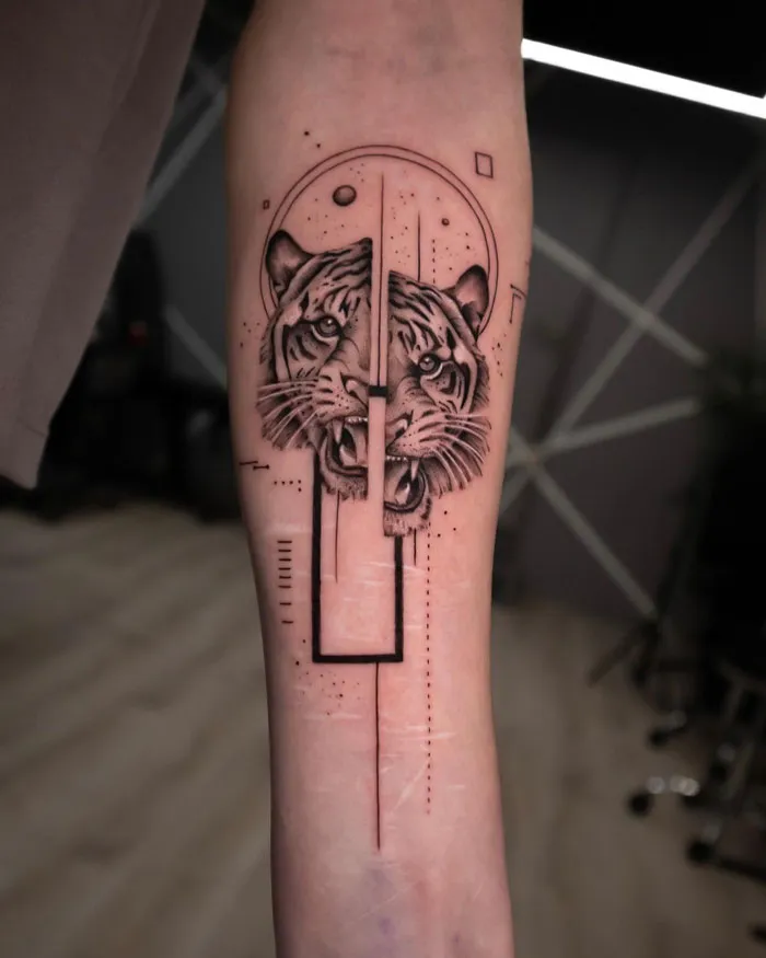 Abstract tiger tattoo on forearm, celebrating the animal kingdom with geometric elements.