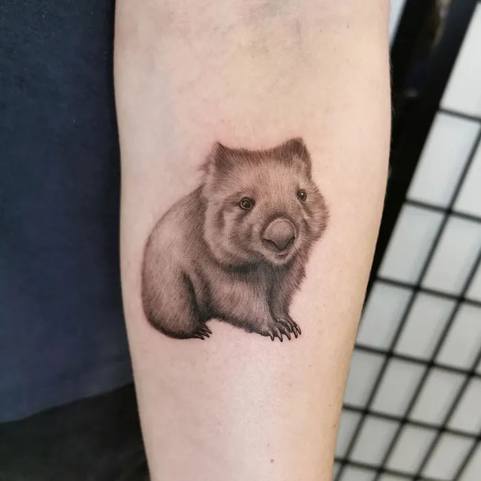 Animal tattoo of a small, detailed wombat on an arm, celebrating the animal kingdom.