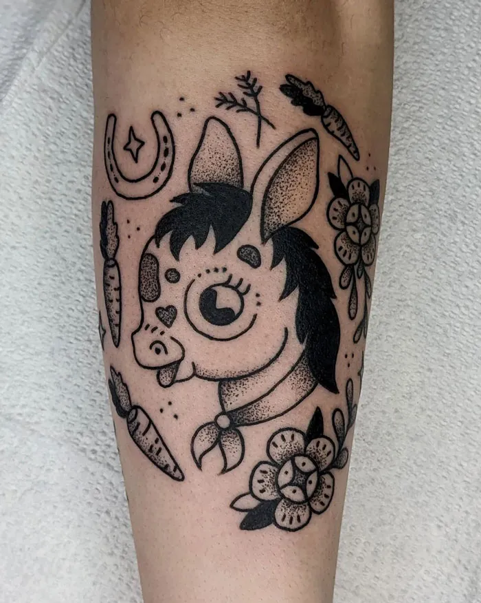 Cute animal tattoo of a horse with flowers and carrots, celebrating the animal kingdom.