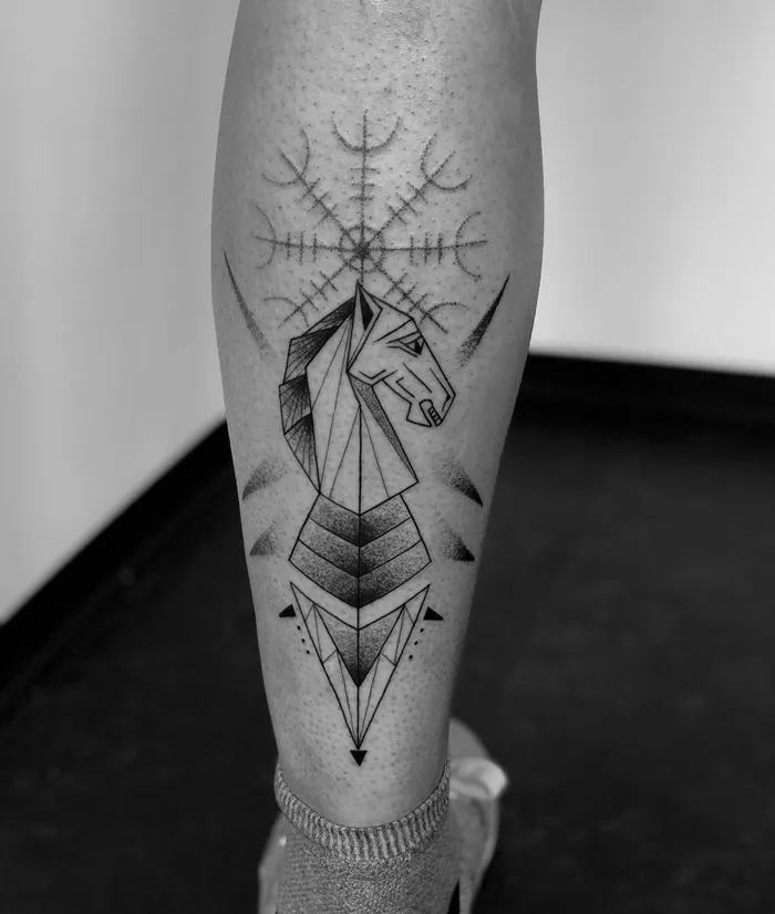 Geometric horse head calf tattoo in black ink, showcasing unique design elements.