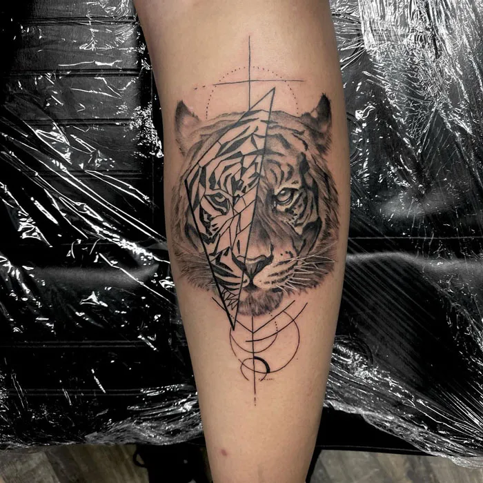 Calf tattoo featuring a geometric tiger design, showcasing cool and artistic elements.