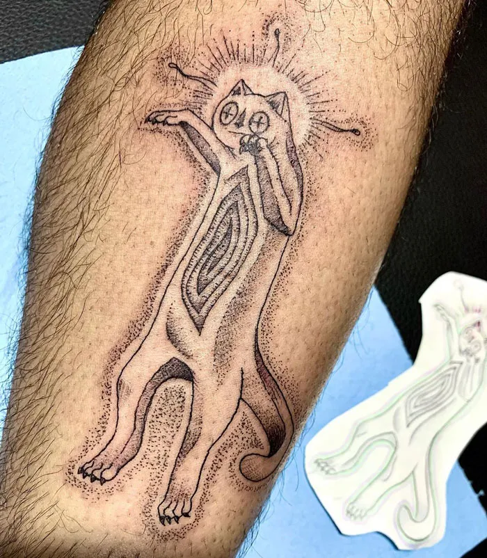 Creative cat-themed calf tattoo showcasing intricate dotwork and abstract design for coolness.
