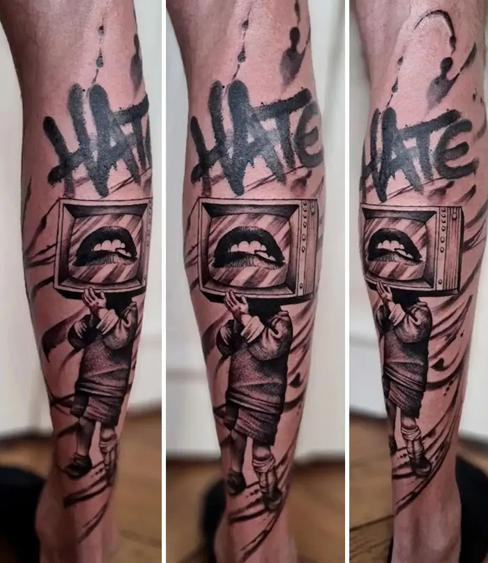 Unique calf tattoo featuring a TV head figure with graffiti text, combining surreal and street art styles.