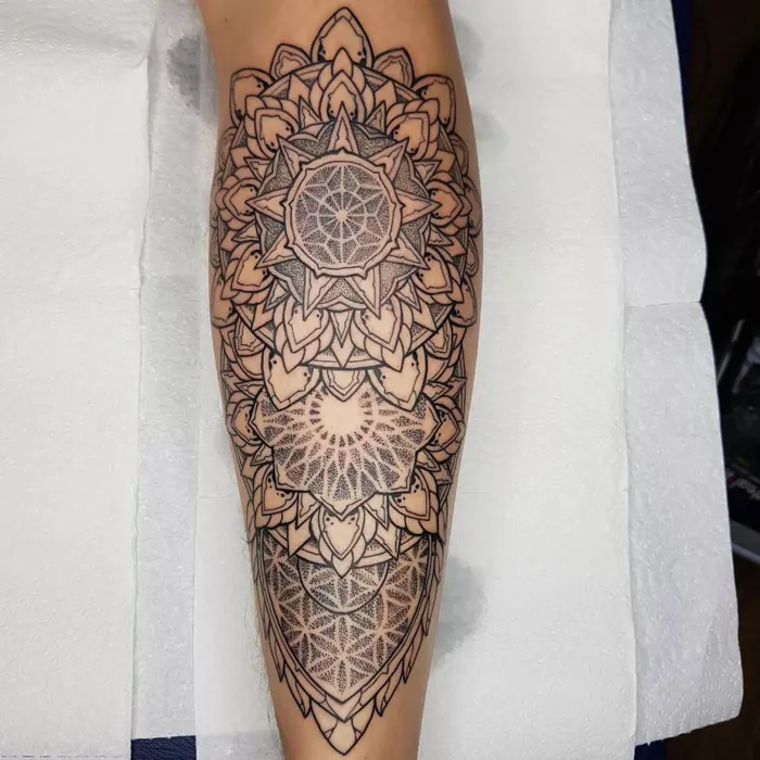 Intricate mandala calf tattoo design showcasing coolness and artistic detail.