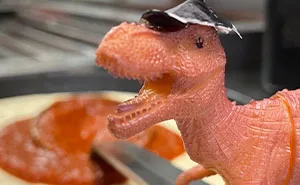 Domino’s Staff Make A Lost Toy Dino An Employee For The Night Until Its Family Come To Bring It Home
