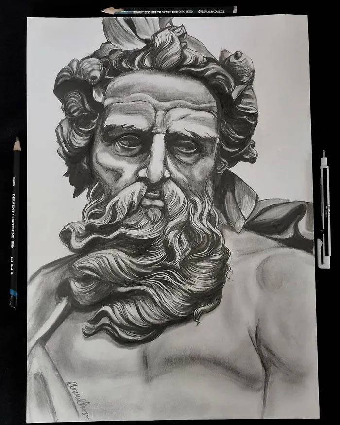 Charcoal drawing of a bearded man resembling a sculpture, surrounded by artist tools, inspiring art ideas.