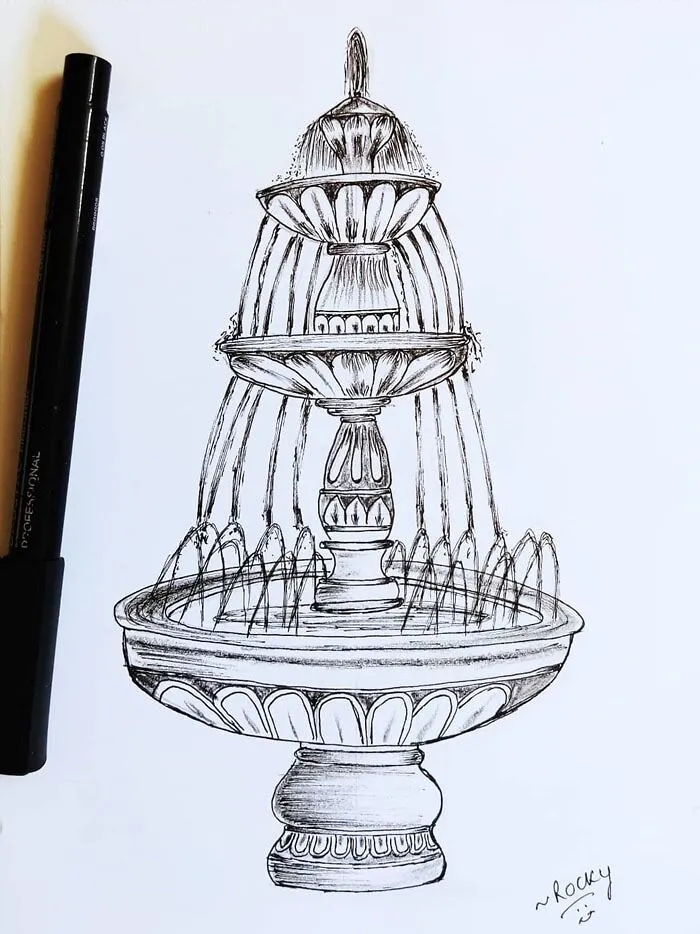 Drawing prompt of an intricate fountain sketch with a black pen beside it.