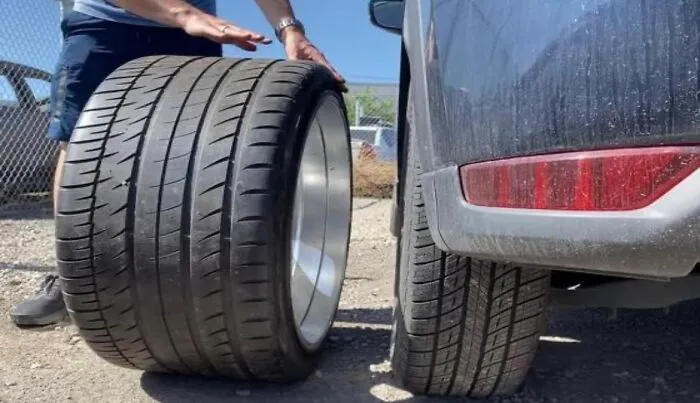 Bugatti Tyre Next To Normal Car Tyre