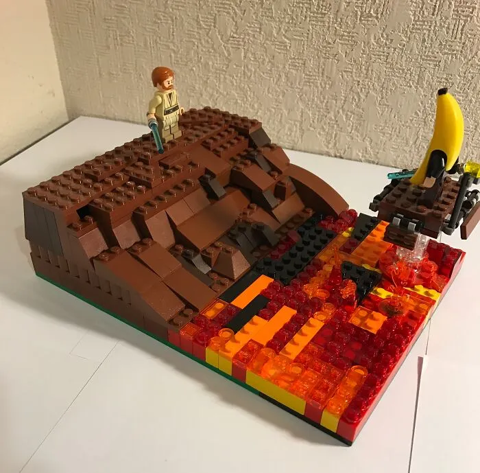 LEGO build depicting a volcanic scene with a minifigure and lava using red, orange, and brown bricks as incredible LEGO art.