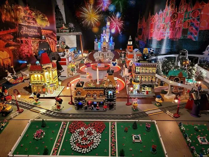 Intricate LEGO builds featuring a colorful cityscape, fireworks, and detailed characters in a vibrant miniature scene.