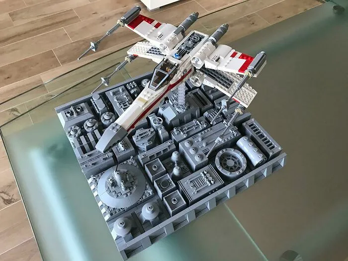 Detailed LEGO build of a sci-fi aircraft displayed on a complex base showcasing incredible LEGO builds as art.